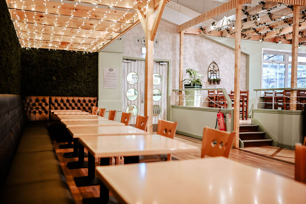 Leaves wallcovering featuring in the fresh new biophilic interiors at Cardwells Garden Centre in Scotland.