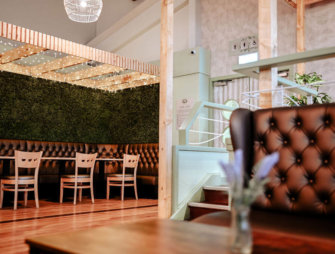 Leaves wallcovering featuring in the fresh new biophilic interiors at Cardwells Garden Centre in Scotland.