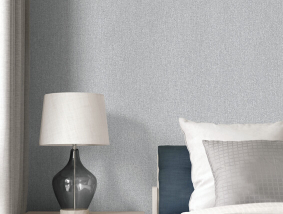 modern style bedroom with pillows on bed and modern grey lamp on side table at home
